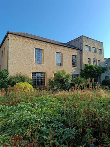A St Anne's College building in the background with gardens in the foreground